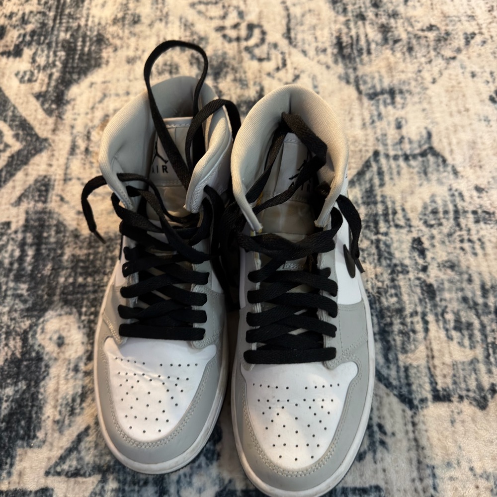 Light Smoke Grey Jordan 1 Mid Sneakers with black laces